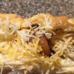 bacon-wrapped-hot-dog-shredded-cheese