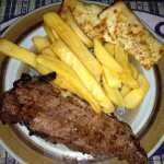 dinner-steak-french-fries-little-caesars-cheese-bread