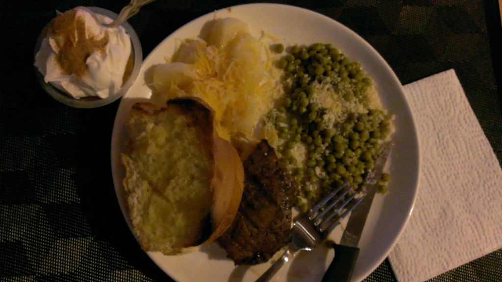 dinner-steak-peas-parmesan-potatoes-cheese-french-bread-butter-garlic-salt-fruit-cup-whipped-cream-cinnamon